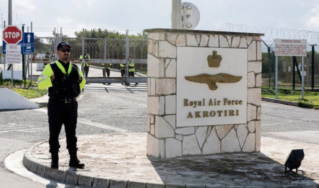 police officers stand guard at the gates of the royal air force akrotiri base a british overseas territory near the cypriot coastal city of limassol photo afp police officers stand guard at the gates of the royal air force akrotiri base a british overseas territory near the cypriot coastal city of limassol photo afp
