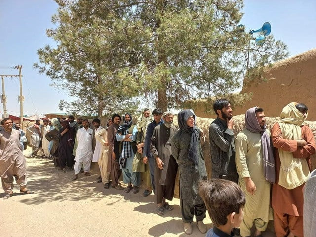 people queue up outside a polling station in balochistan on the occasion of local bodies elections in the province photo express people queue up outside a polling station in balochistan on the occasion of local bodies elections in the province photo express