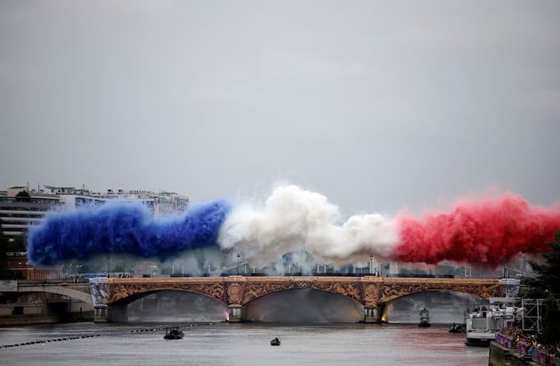 Smoke clouds in the tricolours of the France flag are seen at Pont d'Austerlitz during the opening ceremony. PHOTO: REUTERS