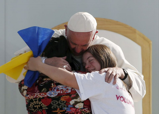 pope francis hugs two girls during a meeting with youths at the jose maria morelos y pavon stadium in morelia mexico february 16 2016 photo reuters file