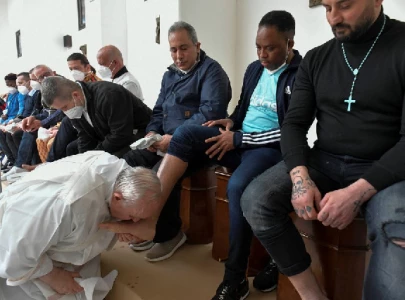 pope visits italian prison for traditional foot washing mass