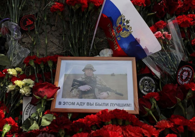 portrait of wagner mercenary chief yevgeny prigozhin at a makeshift memorial near former pmc wagner centre in saint petersburg russia august 25 2023 photo reuters portrait of wagner mercenary chief yevgeny prigozhin at a makeshift memorial near former pmc wagner centre in saint petersburg russia august 25 2023 photo reuters