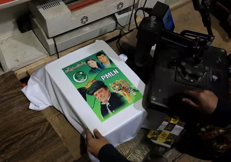 a worker prints a poster depicting former prime minister nawaz sharif on a t shirt in peshawar january 15 2024 photo reuters a worker prints a poster depicting former prime minister nawaz sharif on a t shirt in peshawar january 15 2024 photo reuters