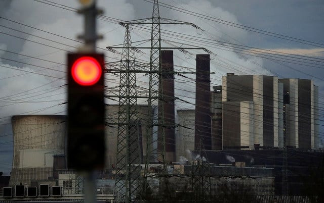 a traffic light signals red in front of the weisweiler brown coal power plant of german energy supplier rwe in weisweiler near aachen germany march 12 2018 photo reuters a traffic light signals red in front of the weisweiler brown coal power plant of german energy supplier rwe in weisweiler near aachen germany march 12 2018 photo reuters