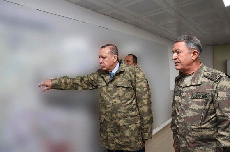 turkey s president recep tayyip erdogan l during a briefing led by chief of the general staff of the turkish armed forces hulusi at the operating base in hatay january 25 photo afp