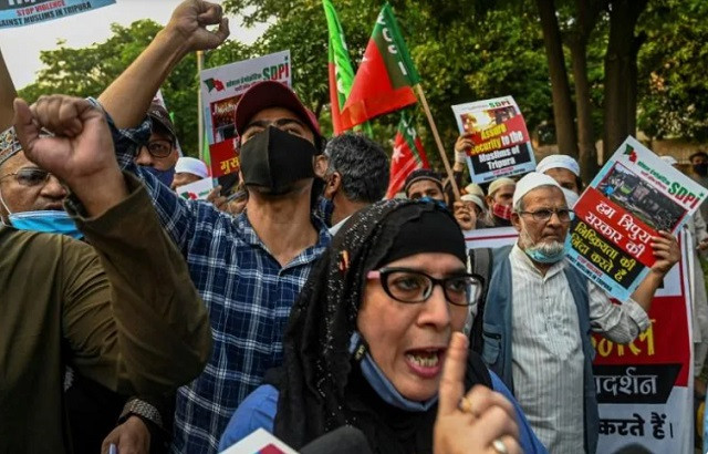 activists shout slogans in new delhi last month during a rally against the recent violence in tripura state photo afp