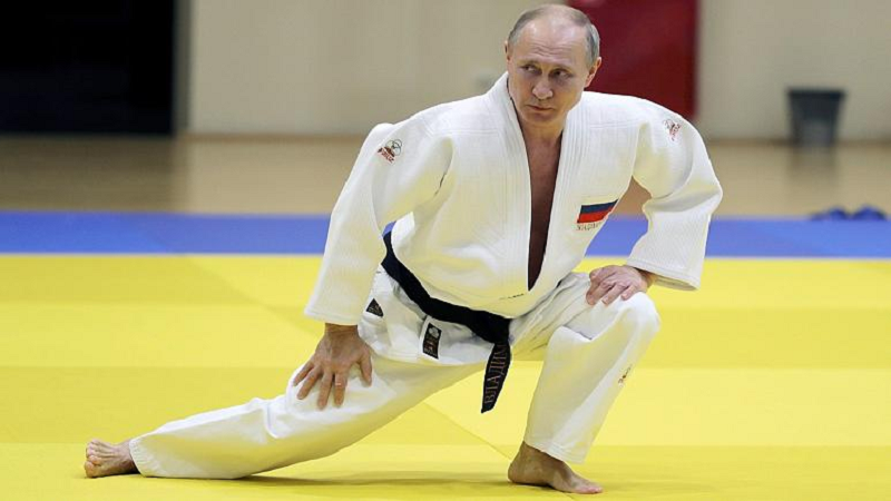 in this pool photo taken on thursday feb 14 2019 russian president vladimir putin right attends a training session with the russian national judo team photo afp