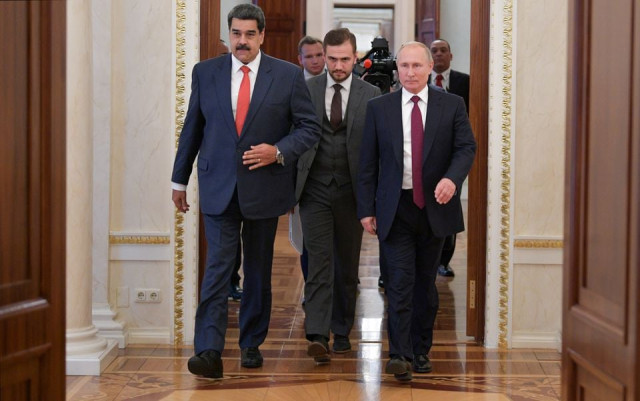 russian president vladimir putin and his venezuelan counterpart nicolas maduro enter a hall during their meeting in moscow russia september 25 2019 photo reuters russian president vladimir putin and his venezuelan counterpart nicolas maduro enter a hall during their meeting in moscow russia september 25 2019 photo reuters