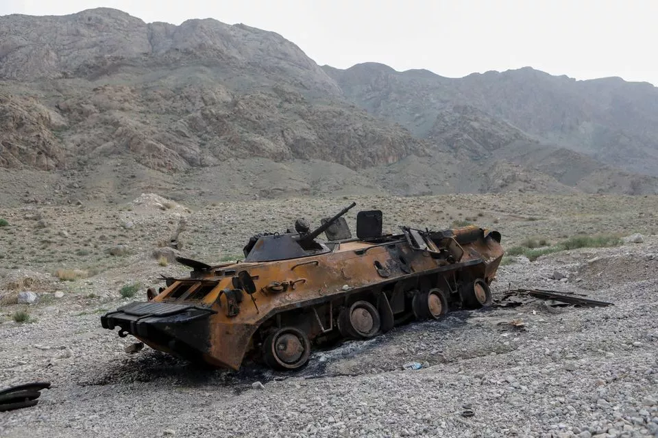 a view shows a burnt armoured personnel carrier of kyrgyz forces near golovnoi water distribution facility outside the village of kok tash in batken province kyrgyzstan may 5 2021 the clashes broke out last week along the frontier between tajikistan s sughd province and kyrgyzstan s southern batken province because of a dispute over a reservoir and pump claimed by both sides on the isfara river reuters vladimir pirogov file photo a view shows a burnt armoured personnel carrier of kyrgyz forces near golovnoi water distribution facility outside the village of kok tash in batken province kyrgyzstan may 5 2021 the clashes broke out last week along the frontier between tajikistan s sughd province and kyrgyzstan s southern batken province because of a dispute over a reservoir and pump claimed by both sides on the isfara river reuters vladimir pirogov file photo