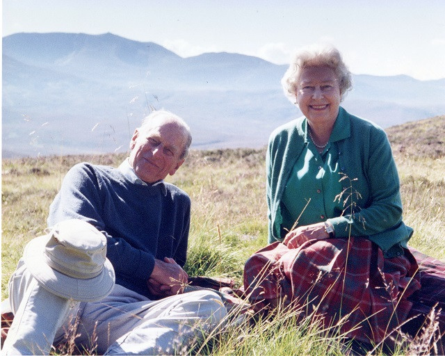 Handout image released by Buckingham Palace of a personal photograph of the Britain's Queen Elizabeth II and Prince Philip, the Duke of Edinburgh at the top of the Coyles of Muick, taken by The Countess of Wessex in 2003, obtained by Reuters on April 16, 2021. PHOTO: REUTERS