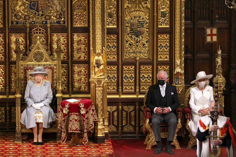 britain s queen elizabeth sits in the house of lord s chamber with prince charles and camilla duchess of cornwall for the state opening of parliament in london britain may 11 2021 photo reuters