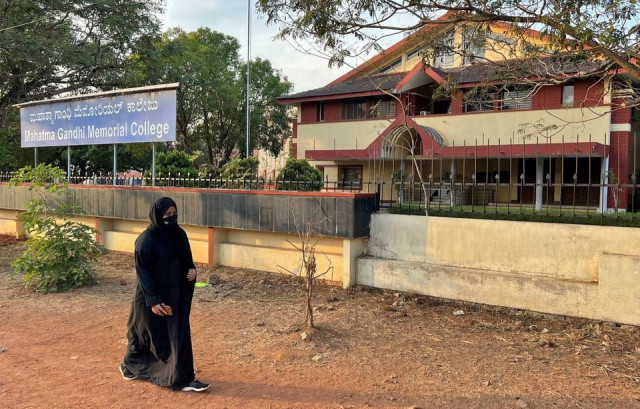 ayesha imthiaz 21 a muslim college student wearing a hijab walks past her college in udupi karnataka state india february 11 2022 reuters ayesha imthiaz 21 a muslim college student wearing a hijab walks past her college in udupi karnataka state india february 11 2022 reuters