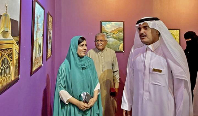 pakistani painter rabia zakir left presents her work during a solo exhibition at al rashid mall in madina on march 8 2022 photo rabia zakir pakistani painter rabia zakir left presents her work during a solo exhibition at al rashid mall in madina on march 8 2022 photo rabia zakir