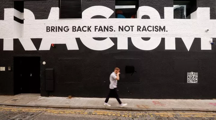 a man walks past sport related anti racism graffiti on the side of a building in london britain june 10 2021 photo reuters a man walks past sport related anti racism graffiti on the side of a building in london britain june 10 2021 photo reuters