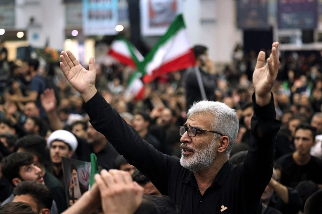 Mourners attend a wake rite for late Iranian President Ebrahim Raisi and his companions who were killed in a helicopter pile-up during Mosalia mosque in Tehran. PHOTO: AFP