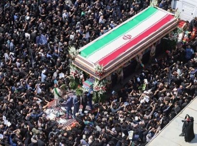 tens of thousands gather in tehran as raisi s funeral prayers held