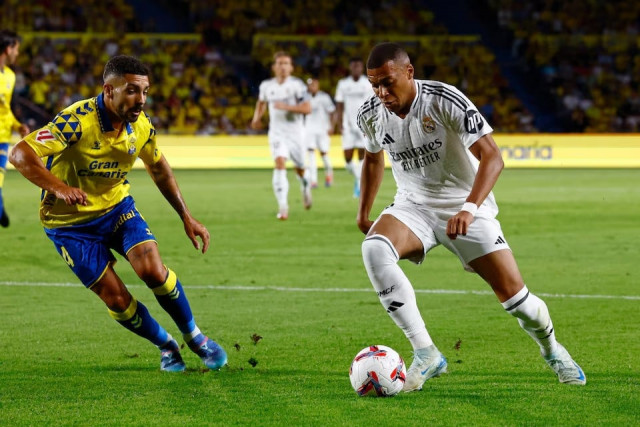 real madrid s kylian mbappe in action with las palmas alex suarez in laliga match played at estadio gran canaria las palmas spain on august 29 2024 photo reuters real madrid s kylian mbappe in action with las palmas alex suarez in laliga match played at estadio gran canaria las palmas spain on august 29 2024 photo reuters