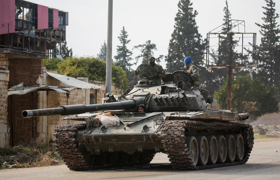 rebels led by hayat tahrir al sham drive a military vehicle in al rashideen aleppo province syria on november 29 2024 photo reuters