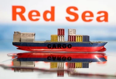a cargo ship boat model is seen in front of red sea words in this illustration taken january 9 2024 photo reuters