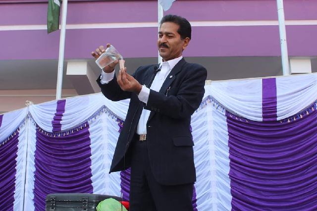 iqbal hussain performing magic trick at an event photo express file