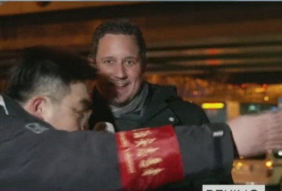 watch dutch reporter dragged away during live broadcast in beijing
