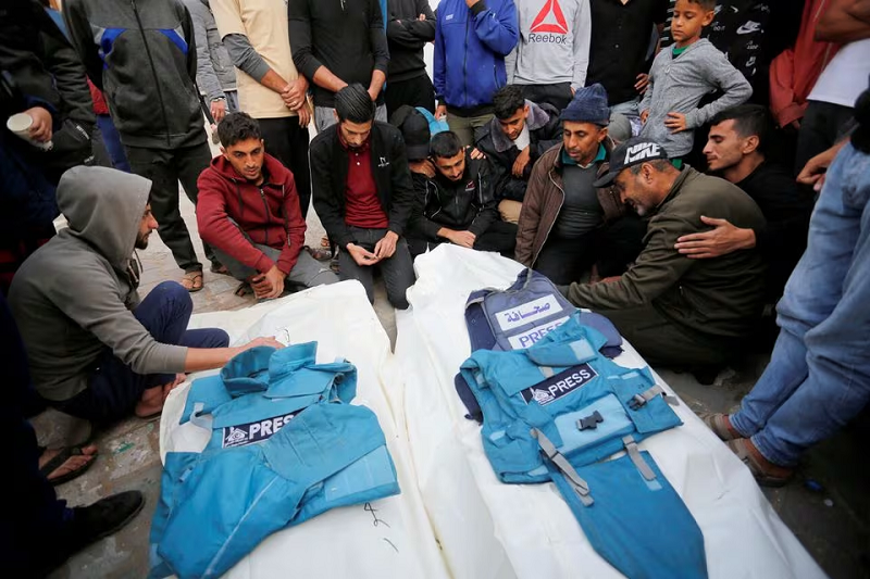 Palestinians mourn local journalists Hassouna Sleem and Sary Mansour, who were killed in an Israeli strike on a house, at a hospital in the central Gaza Strip November 19, 2023. PHOTO: REUTERS