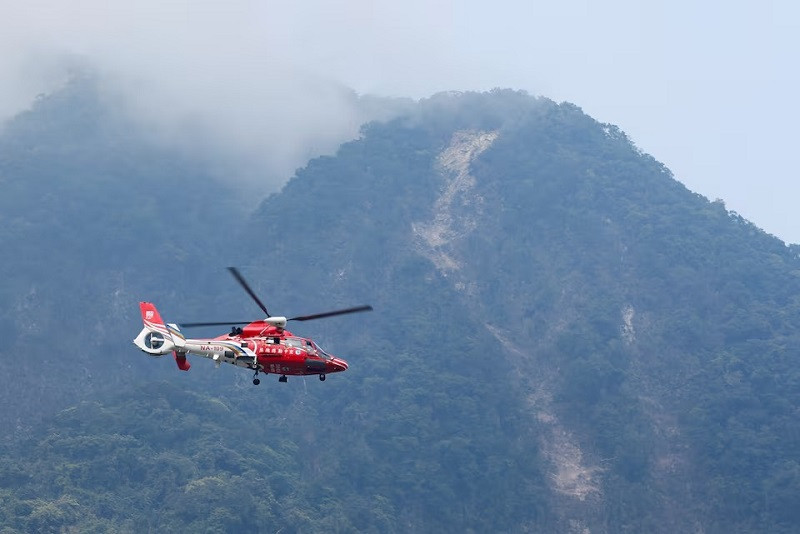a rescue helicopter flies past the area of a landslide following the earthquake in hualien taiwan april 4 2024 photo reuters