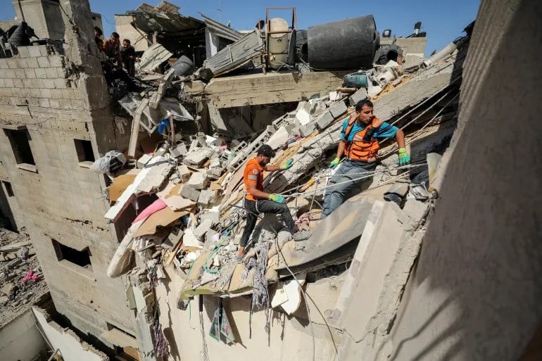 rescuers work to recover the body of a palestinian girl from under the rubble of a house hit in gaza city photo reuters