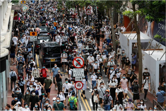 anti national security law protesters march at the anniversary of hong kong s handover to china from britain in hong kong china photo reuters file anti national security law protesters march at the anniversary of hong kong s handover to china from britain in hong kong china photo reuters file