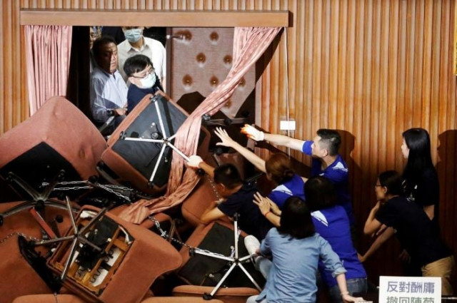 taiwan is a rambunctious democracy and fights and protests inside the parliament building are not uncommon