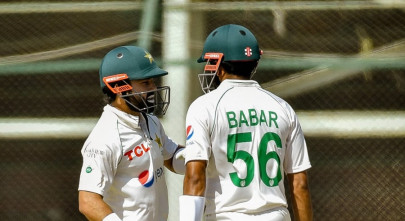 babar s 196 and rizwan s century lead pakistan to earn draw in karachi test