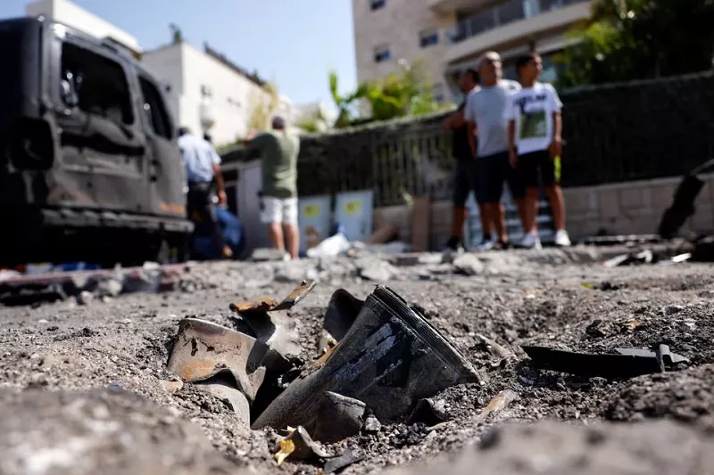 the remains of a rocket fired from the gaza strip into israel lies on a road where it fell in ashkelon southern israel october 10 2023 photo reuters the remains of a rocket fired from the gaza strip into israel lies on a road where it fell in ashkelon southern israel october 10 2023 photo reuters