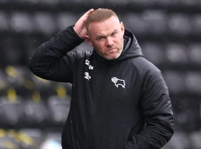 rooney vows to stay at derby despite club entering administration
