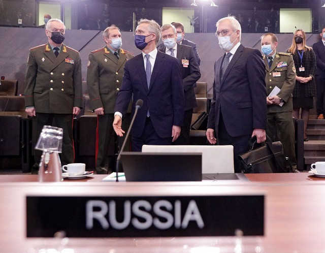 russian deputy foreign minister alexander grushko and nato secretary general jens stoltenberg are seen during nato russia council at the alliance s headquarters in brussels belgium january 12 2022 photo reuters