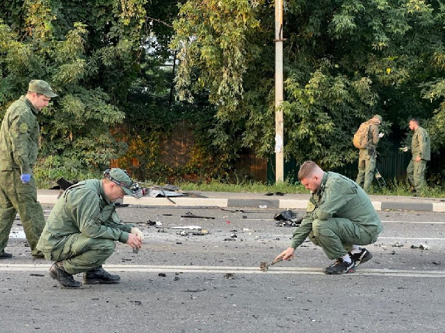 investigators work at the site of a suspected car bomb attack that killed darya dugina daughter of ultra nationalist russian ideologue alexander dugin in the moscow region russia august 21 2022 photo reuters