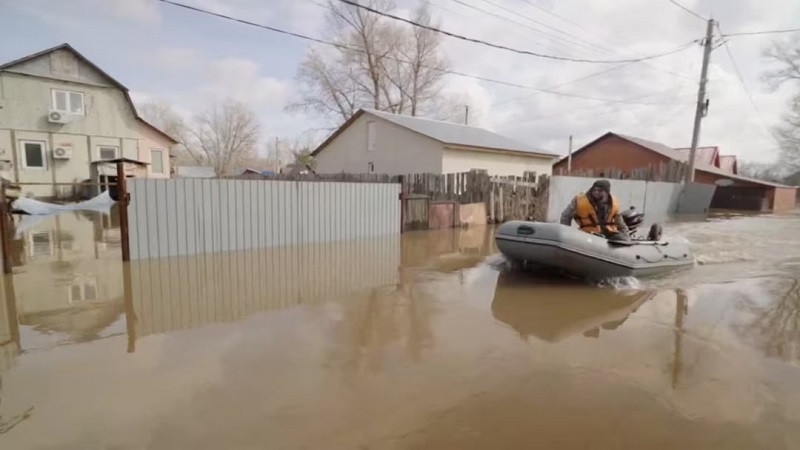 a man rides a boat in a flooded street in orenburg russia in this still image taken from video released april 8 2024 photo reuters