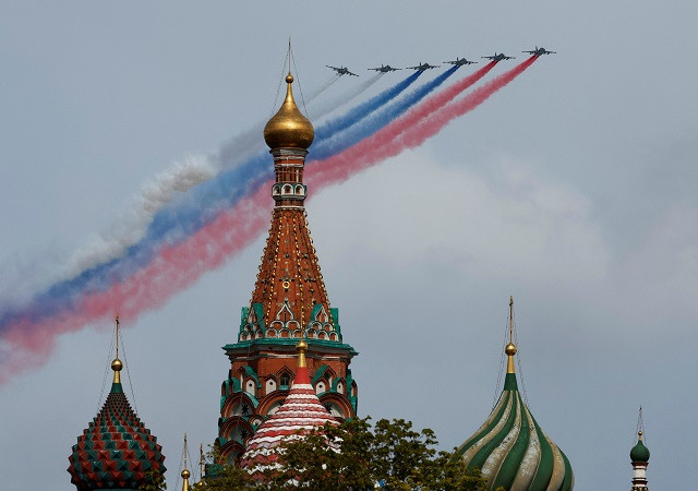 Russian Su-25 jet aircraft release smoke in the colours of the Russian state flag over St. Basil's Cathedral during a flypast and a military parade on Victory Day.  PHOTO: Reuters