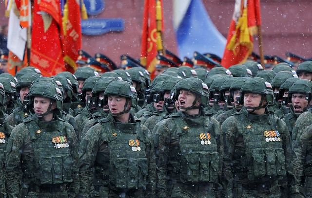 Russian service members, who were involved in the country's military campaign in Ukraine, march in columns during a military parade on Victory Day. PHOTO: Reuters