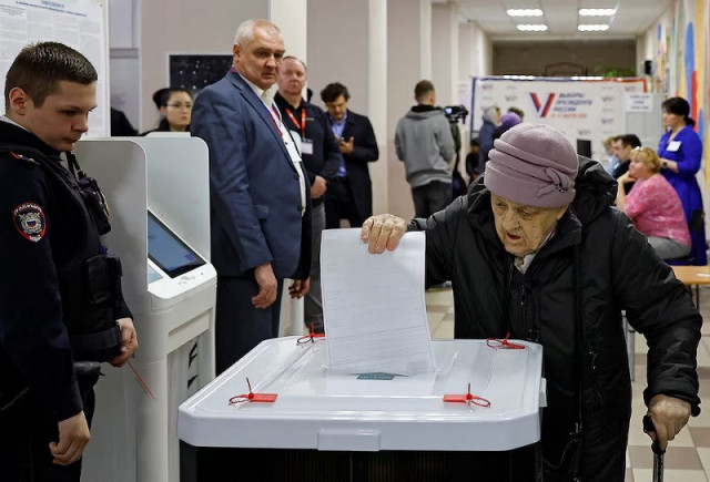 a woman casts her ballot at a polling station during the presidential election in moscow russia march 16 2024 photo reuters