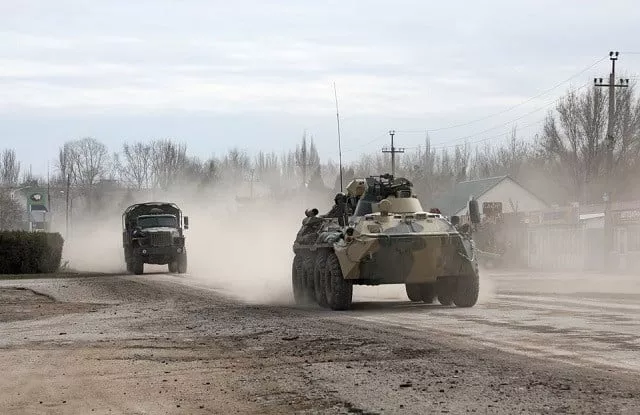 russian army military vehicles drive along a street after russian president vladimir putin authorised a military operation in eastern ukraine in the town of armyansk crimea february 24 2022 photo reuters russian army military vehicles drive along a street after russian president vladimir putin authorised a military operation in eastern ukraine in the town of armyansk crimea february 24 2022 photo reuters
