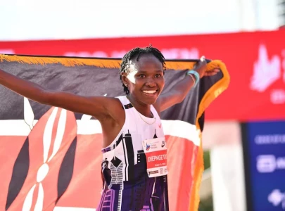 chepngetich runs into history smashes women s marathon world record