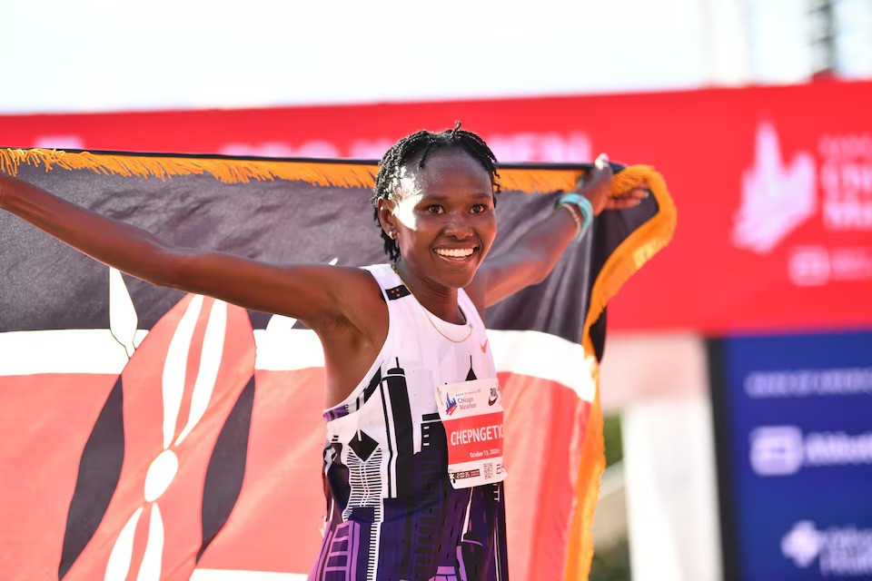 ruth chepngetich of kenya celebrates after finishing first in the women s race setting a new world record at 2 09 56 during the chicago marathon at grant park on october 13 2024 in chicago il usa photo reuters