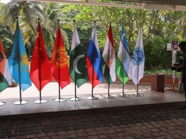 a video journalist films flags of countries participating in the shanghai cooperation organisation sco foreign ministers meeting outside the venue in goa india may 4 2023 photo reuters a video journalist films flags of countries participating in the shanghai cooperation organisation sco foreign ministers meeting outside the venue in goa india may 4 2023 photo reuters