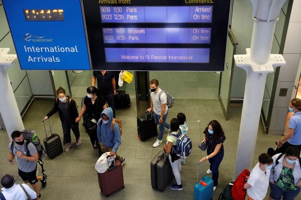 passengers wearing protective face masks arrive from paris at eurostar terminal at st pancras station as britain imposes a 14 day quarantine on arrival from france from saturday following the outbreak of the coronavirus disease covid 19 in london britain august 14 2020 photo reuters passengers wearing protective face masks arrive from paris at eurostar terminal at st pancras station as britain imposes a 14 day quarantine on arrival from france from saturday following the outbreak of the coronavirus disease covid 19 in london britain august 14 2020 photo reuters