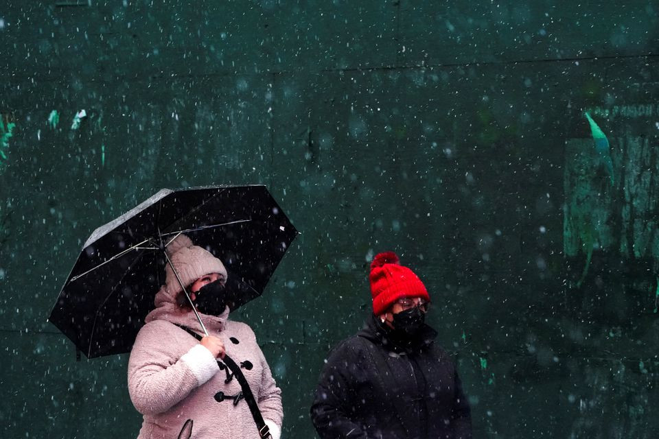 people walk in the snow in the manhattan borough of new york city new york us photo reuters