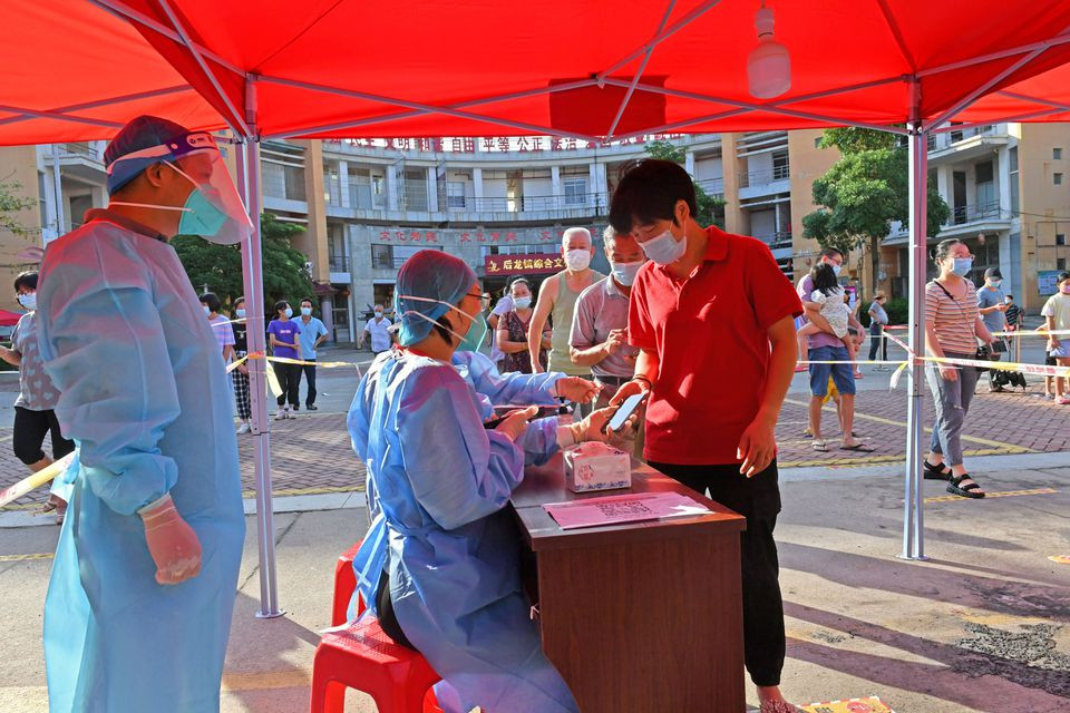 residents register to take nucleic acid tests at a testing site in quanzhou following new cases of the coronavirus disease covid 19 in fujian province china september 13 2021 photo reuters