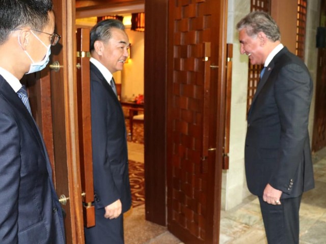 chinese state councillor and foreign minister shah wang yi receives foreign minister shah mehmood qureshi at hainan province in china on august 21 2020 photo pid