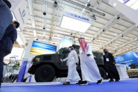 saudi men are seen walking in front of ukrainian stand displaying the latest defense system at world defence show in riyadh saudi arabia march 6 2022 photo reuters