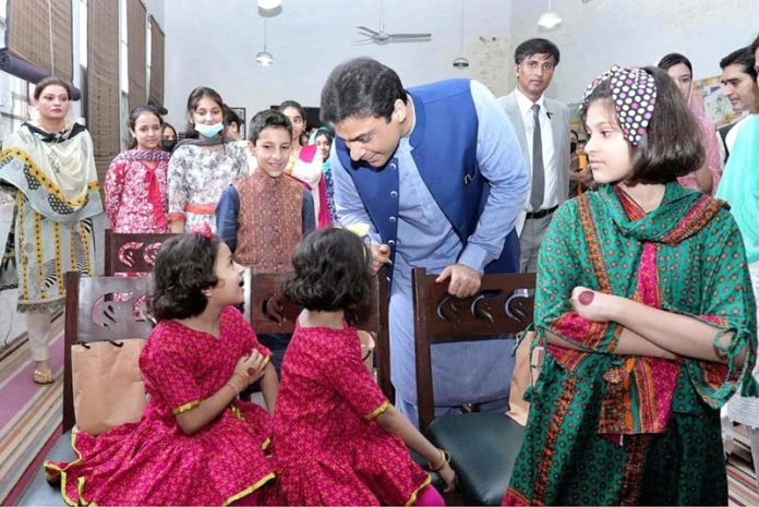 punjab chief minister hamza shahbaz is talking to the children of sos village on eid day photo app