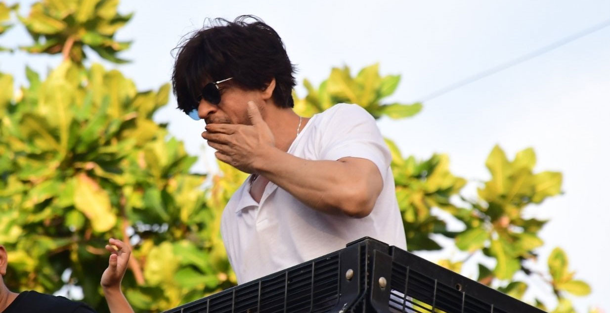 In pics: 'Pathaan' star Shah Rukh Khan shakes hands, blows flying